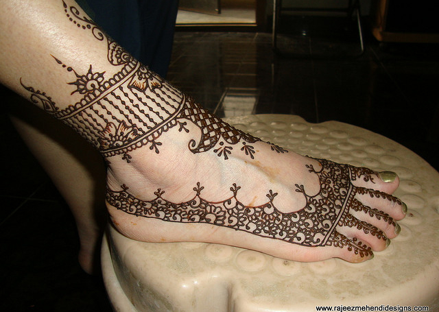 Bridal Mehandi Design with strings, flowers and geometrical patterns