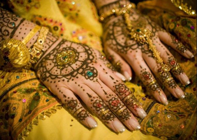 Bridal Mehandi Design with sparkles and floral motifs