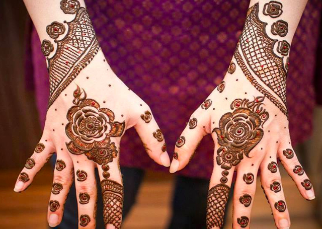 Bridal Mehandi Design with tiny rose buds on the fingers studded with stones