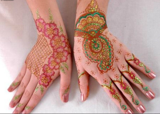 Colorful Bridal Mehandi Design featuring flowers and ambi