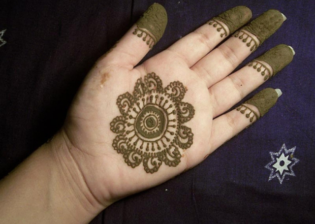 Latest Simple Mehandi Design featuring traditional design and capped fingers