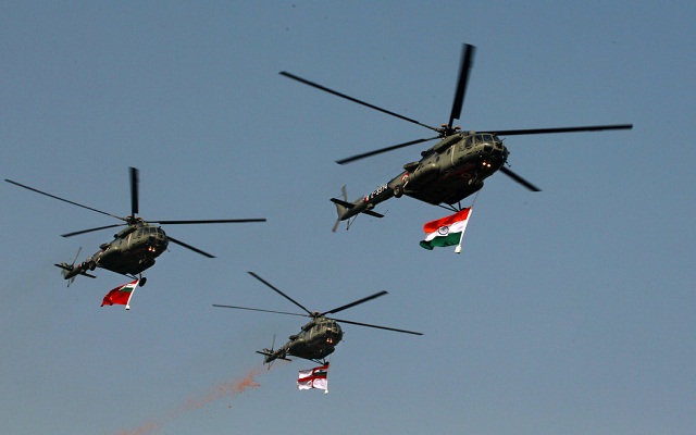 Indian army helicopters fly in formation over the main Republic Day parade on Rajpath, in New Delhi, Thursday, Jan. 26, 2012. India is marking it's 62nd Republic Day with military parades across the country. (AP Photo/Kevin Frayer)